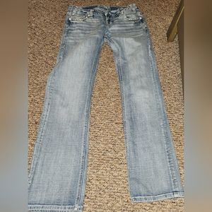 Rock and roll cowgirl riding jeans